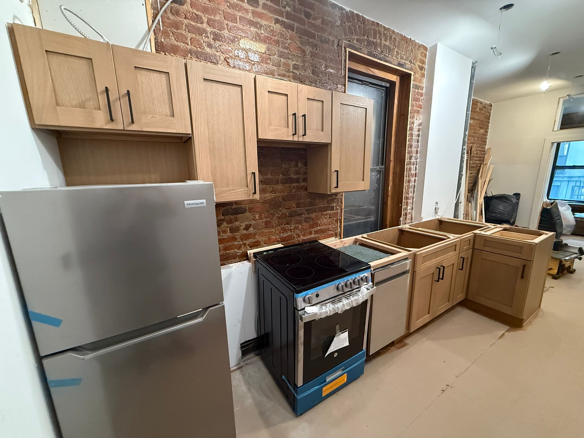 Kitchen remodel in NYC brownstone with exposed brick